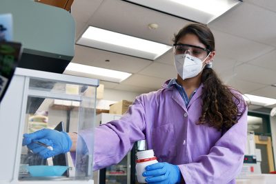 Student in a lab preparing an experiment