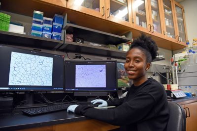 Smiling African American female student in lab