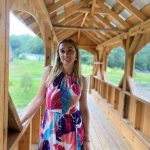 Danielle Fisher standing in a covered bridge