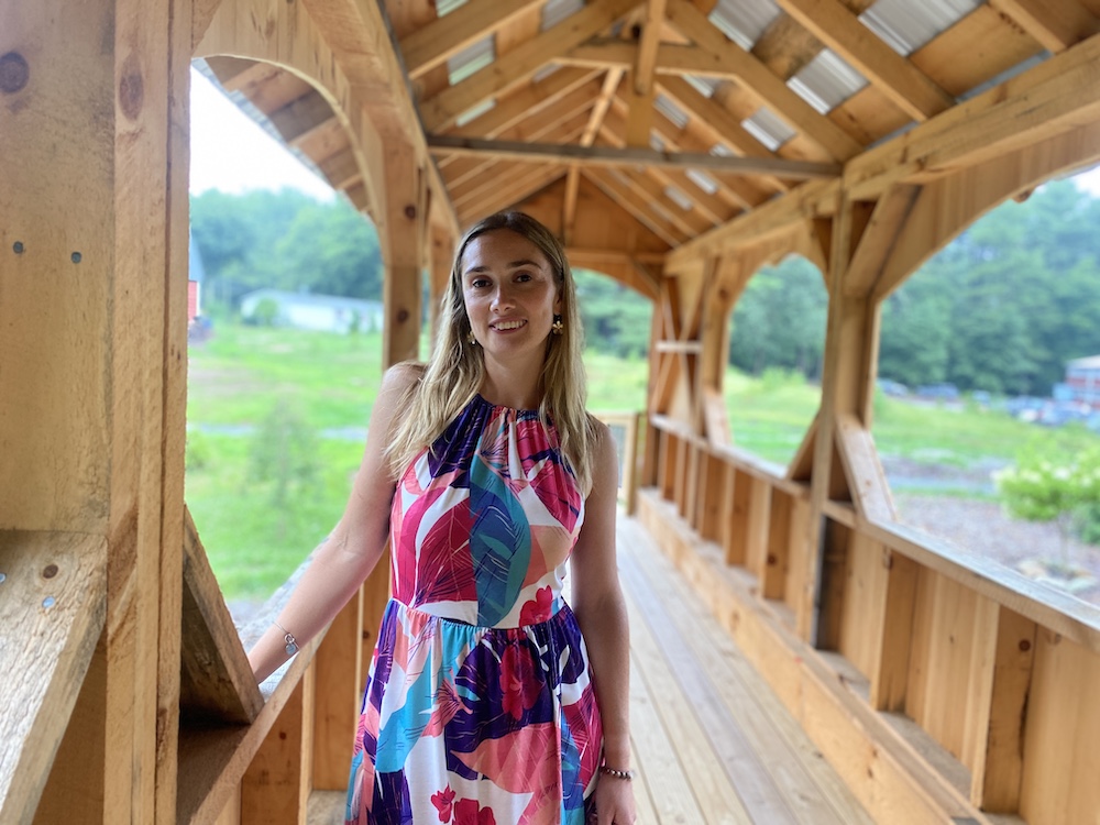 Danielle Fisher standing in a covered bridge