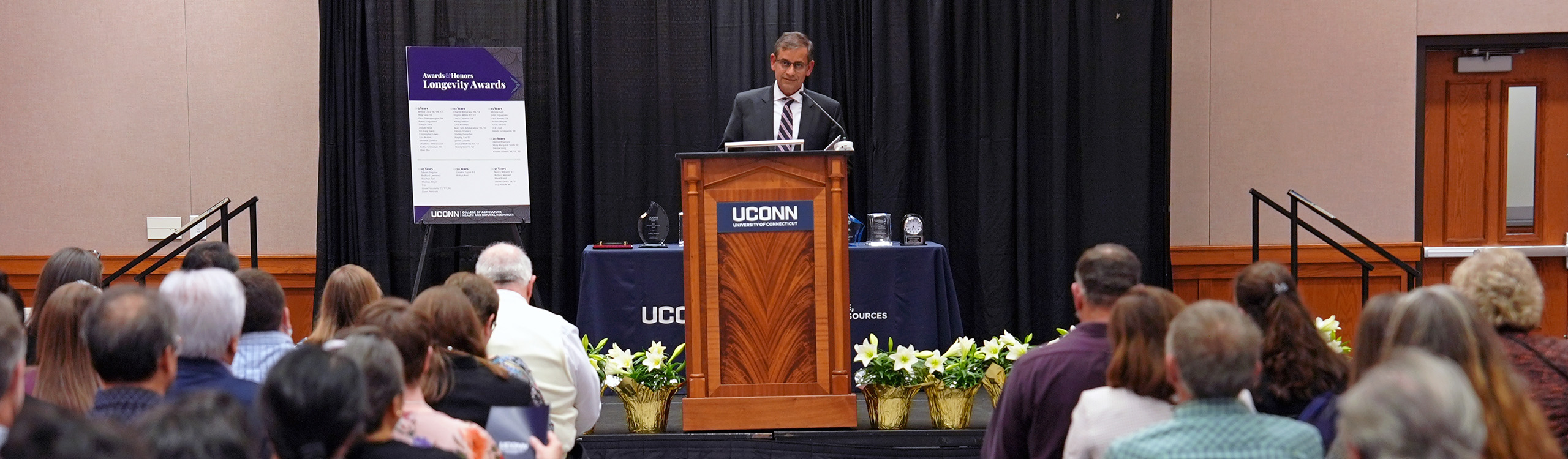 Dean Chaubey speaking at awards ceremony