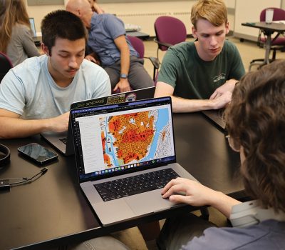 students looking at maps during ECO story map class